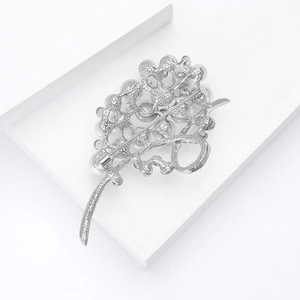 Detailed back view of silver leaf pearl brooch showing the secure pin fastener