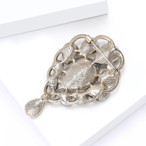 Vintage leaf-shaped brooch with teardrop pendant and secure clasp back view