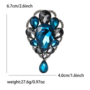 Elegant vintage blue crystal brooch with teardrop gemstones and dangling pendant accent