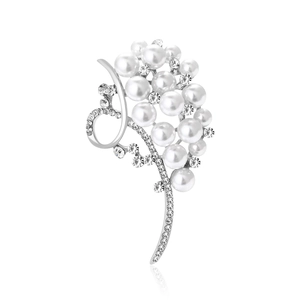 Elegant silver grape cluster brooch with white pearls and sparkling zircons on white backdrop