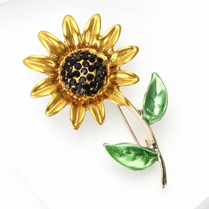 Broche tournesol élégante en alliage doré avec cristaux noirs et feuilles émaillées