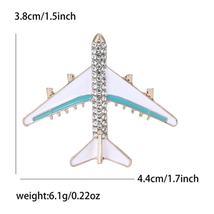 Creative airplane brooch in alloy with blue and white enamel inlay and sparkling rhinestones