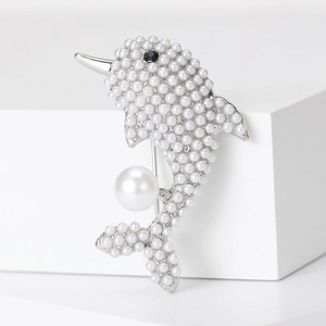 Elegant silver dolphin brooch with pearl pavé and large round drop on white stand