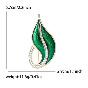 Elegant emerald green leaf brooch with sparkling crystals and gold plating, 5.7cm size