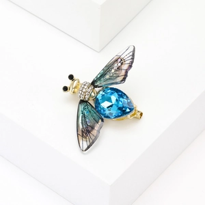 Exquisite gold bee brooch with light blue teardrop crystal and shimmering wings