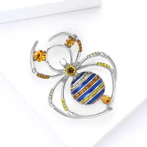 Luxury spider brooch with yellow rhinestones and striped enamel on a silver base