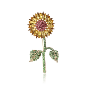 Sunflower crystal brooch with pink center and yellow petals on golden base