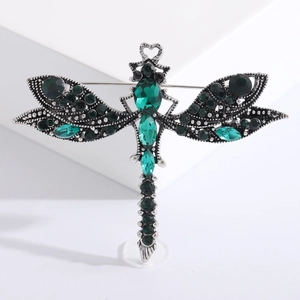 Vintage crystal dragonfly brooch with emerald green rhinestones on silver alloy base