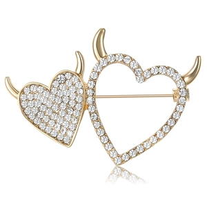 Exquisite golden devil heart brooch with sparkling crystals and a twin heart design