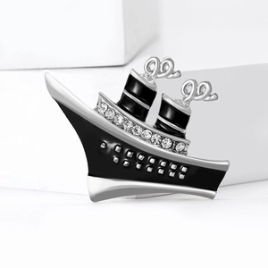 Fashion alloy steamship brooch with black enamel, silver plating and white rhinestones