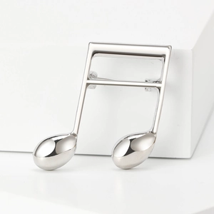 Minimalist silver music note brooch with high-polished finish for suits and accessories