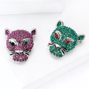 Luxurious handmade leopard head brooches set with sparkling rhinestones in purple and green