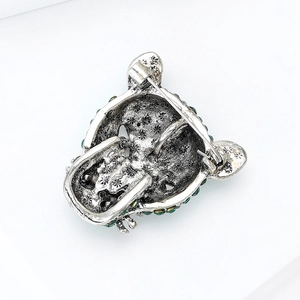 Detailed back view of silver leopard brooch showing sturdy pin clasp and metal texture