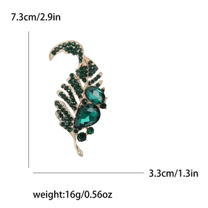 Elegant vintage leaf brooch with green crystals and gold base for women suit