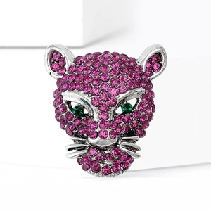 Silver leopard head brooch encrusted with pink and green rhinestones on white display
