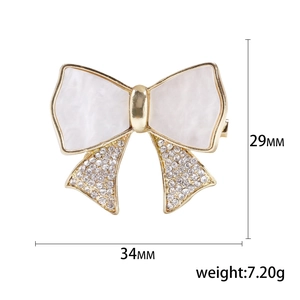 Elegant rhinestone bow brooch with marble texture, measuring 34mm x 29mm, stylish alloy pin