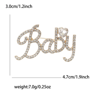 Broche Baby en alliage doré avec strass et cristal de cœur, dimensions 3,0 cm x 4,7 cm
