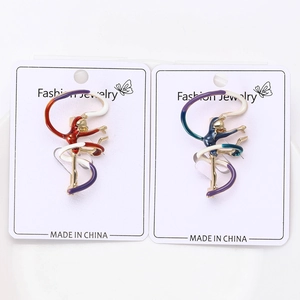 Detail view of colorful rhythmic gymnastics girl brooches on fashion display card