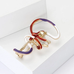 Creative enamel monkey brooch in gold finish with red and purple colors for women