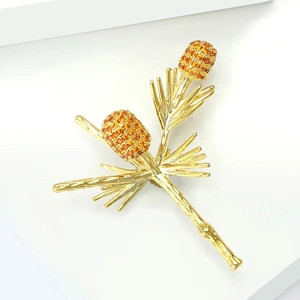Vintage golden pine branch brooch with amber crystal pinecones on white display