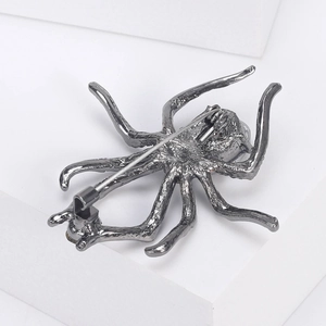 Spider brooch in gunmetal finish with secure rotating safety pin on back