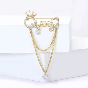 Elegant gold Queen letter brooch with crown, micro-set zircons and tassel pendant