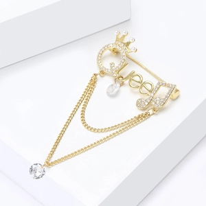 Elegant gold Queen brooch with micro-pave zircons, crown motif, and hanging tassels
