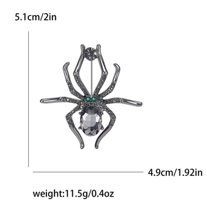 Gothic spider brooch in dark grey alloy with green rhinestones and size measurements
