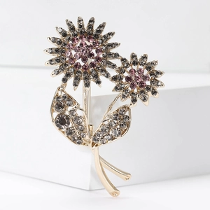 Detailed macro view of sunflower brooch with lavender and smoky rhinestones inlay