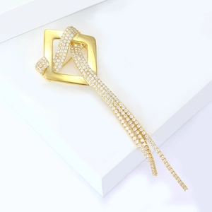 Elegant gold square tassel brooch with pavé zircon crystals shown at a 45-degree angle