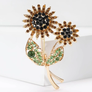Elegant gold finish sunflower brooch with amber rhinestones and black crystal centers