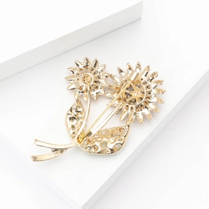 Detailed back view showing the metal hollow petals and pin clasp of the sunflower brooch
