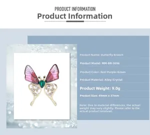 Macro detail of butterfly brooch with purple gradient wings and green teardrop gem