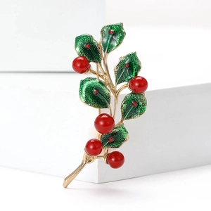 Christmas berry leaf brooch with green enamel and red pearls on gold alloy base