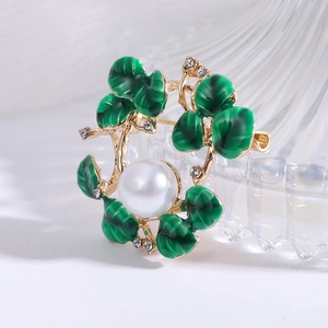 Elegant gold flower wreath brooch with emerald enamel leaves and a large pearl center