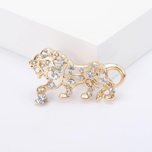 Hollow gold-plated tiger brooch with sparkling rhinestones on minimalist white display