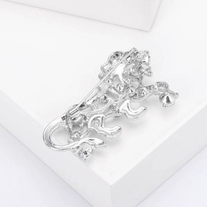 Detailed back view of silver hollow tiger brooch featuring pin fastener and metal craftsmanship