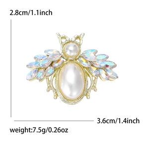 Detail view of pearl bee brooch with dimensions 2.8cm by 3.6cm and weighing 7.5g