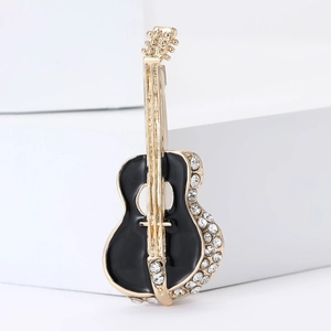 Elegant gold-tone guitar brooch with black enamel inlay and sparkling rhinestone details