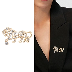 Golden lion hollow brooch with crystals shown on suit and as product close-up