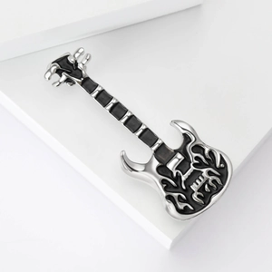 Detailed macro shot of electric guitar brooch with silver polish and black enamel flames