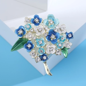 Elegant blue enamel hydrangea brooch with rhinestones and green leaves on golden stem