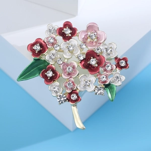 Close-up of enamel hydrangea brooch with colorful petals and sparkling rhinestones