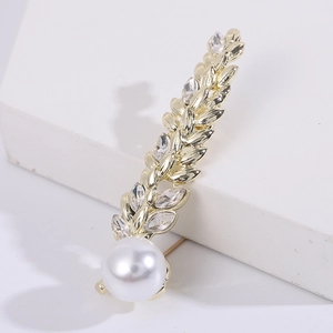 Elegant gold wheat brooch with marquise crystals and a large white pearl on stone
