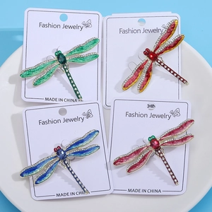 Chic dragonfly brooch set with enamel wings and rhinestones in four vibrant colors