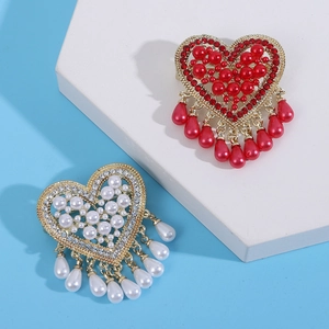Elegant heart brooch with pearls and rhinestones on gold base with dangling teardrop pearl
