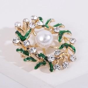 Elegant floral wreath brooch with green enamel leaves, crystals and a central pearl