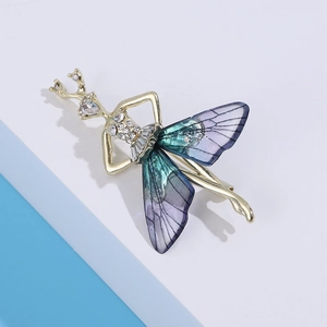 Macro shot of elegant ballet dancer brooch with gradient butterfly wing design and rhinestones