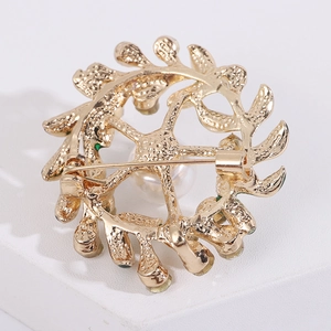 Close-up of the secure pin buckle and hollow metal frame on the floral brooch back