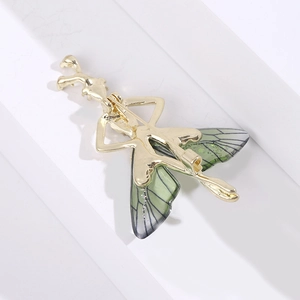 Detail showing back view of insect brooch with golden safety pin clasp closure mechanism